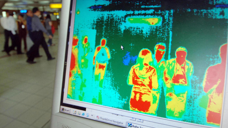 Images from a thermal imaging scanner are pictured on a computer screen at Bali's international airport.